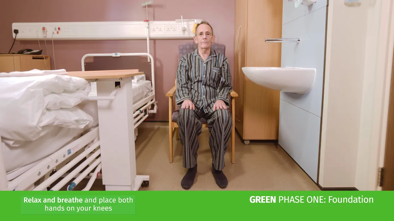 a man sitting in a hospital chair